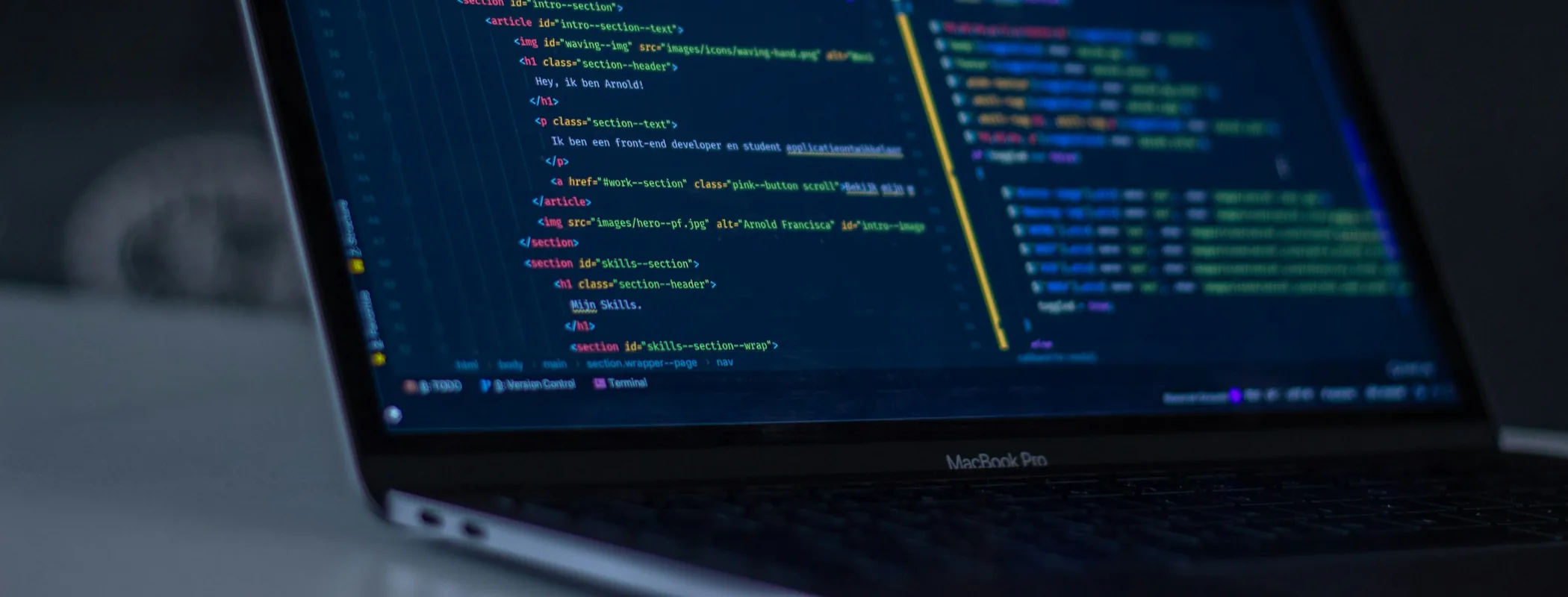 A code editor open on a laptop in a CodeX development workstation